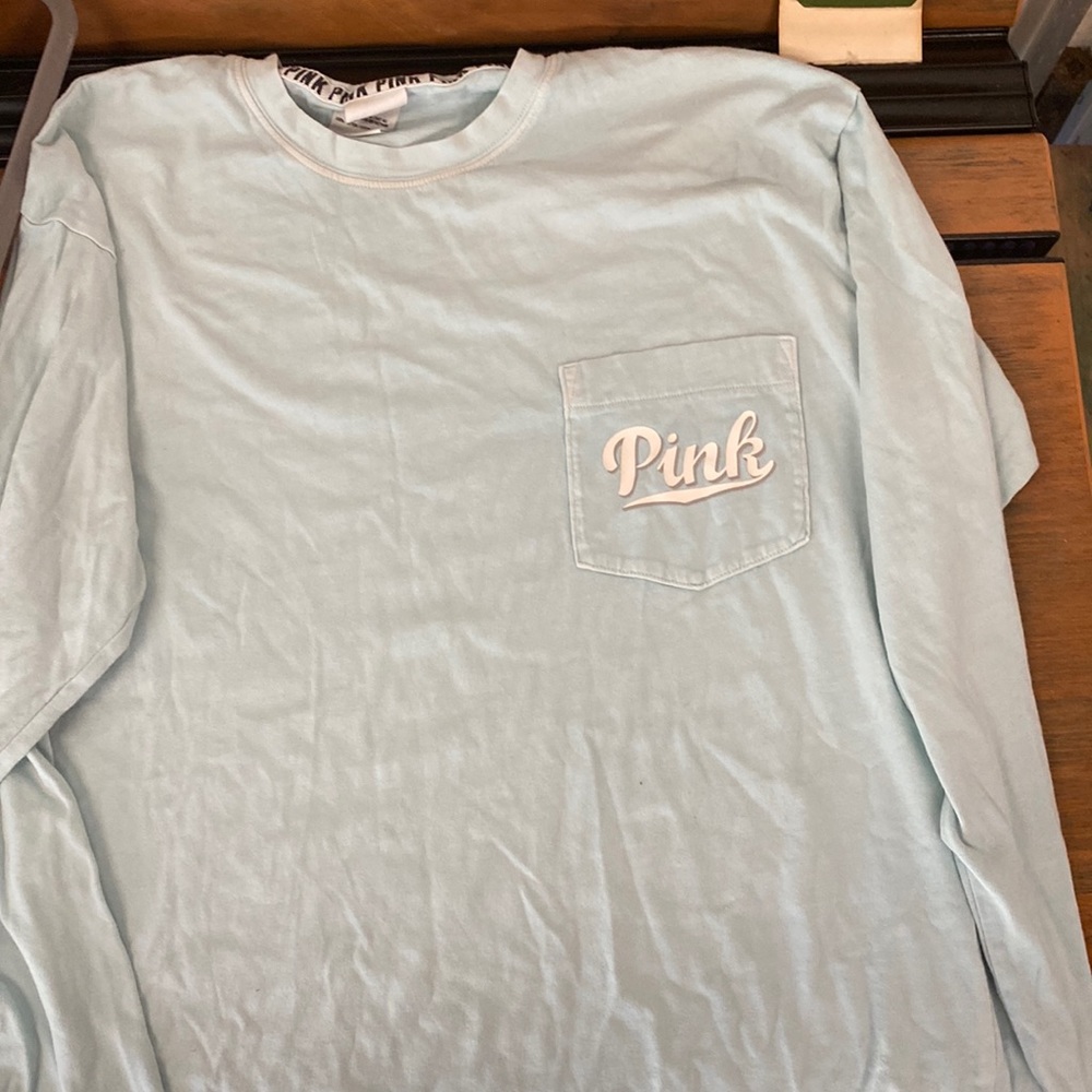 Pink Victoria’s Secret.  Size small.  Light blue.  Long sleeve shirt